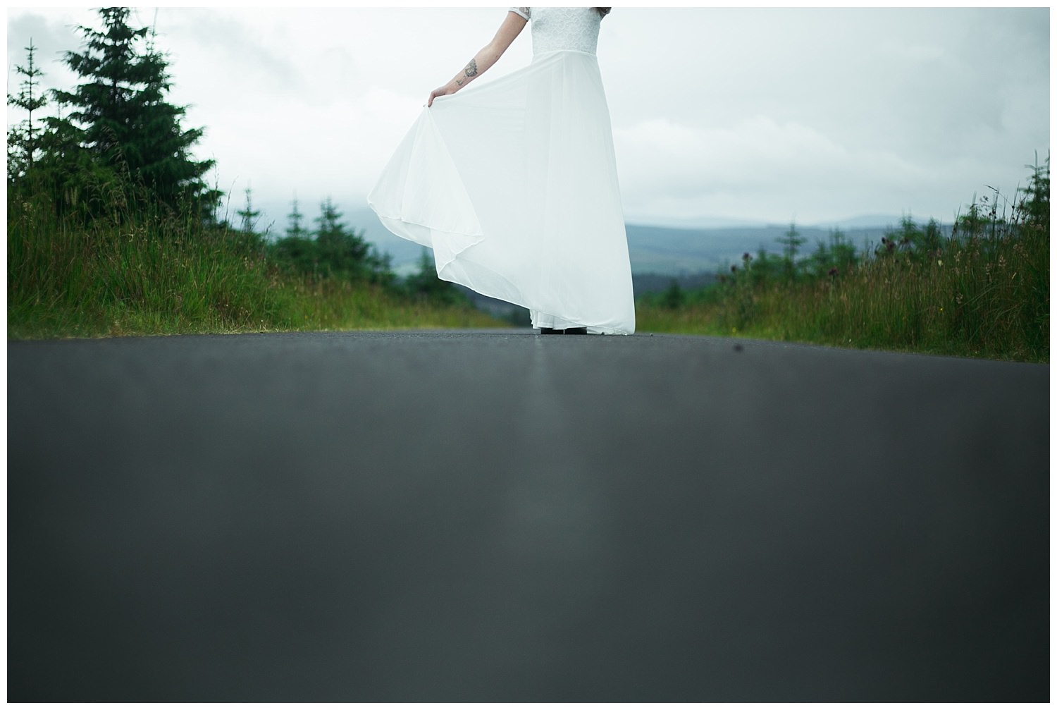 A floor height perspective of a white wedding dress tail 