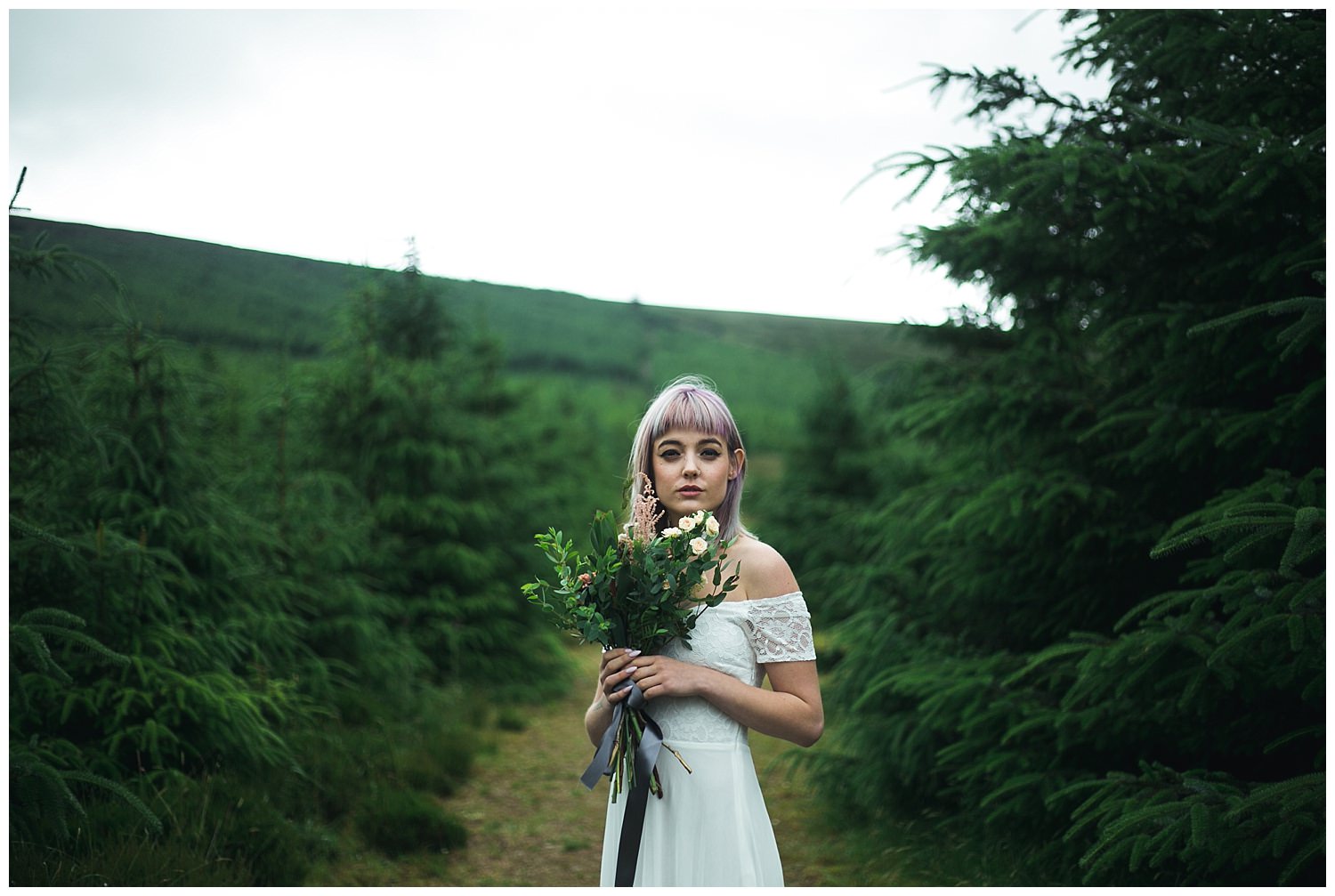 Styled wedding shoot amongst green pine trees in Kippure Wicklow