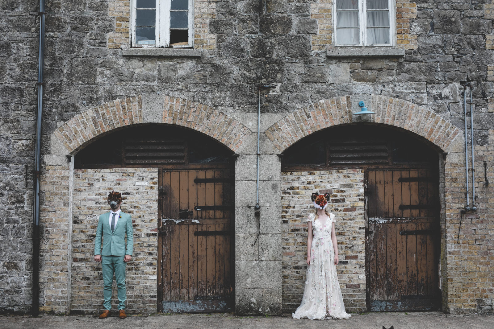 animal masks on a bride & groom