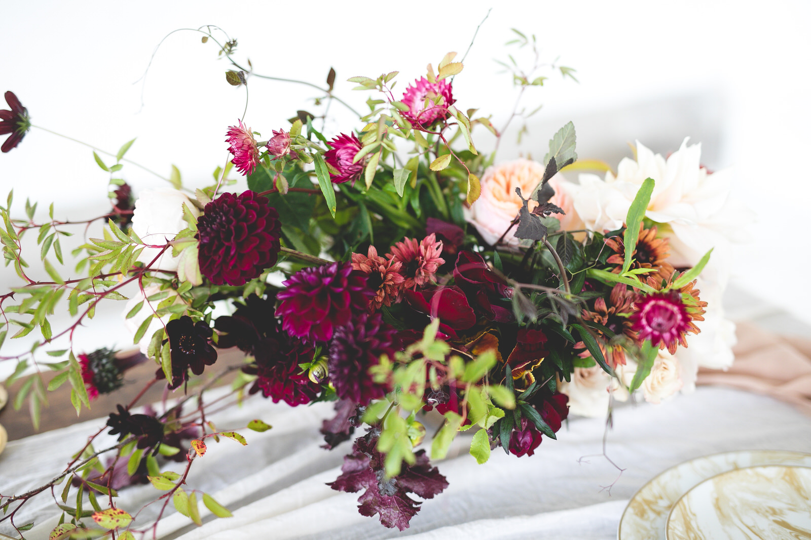 Wild burgundy & pale pink floral centrepiece 