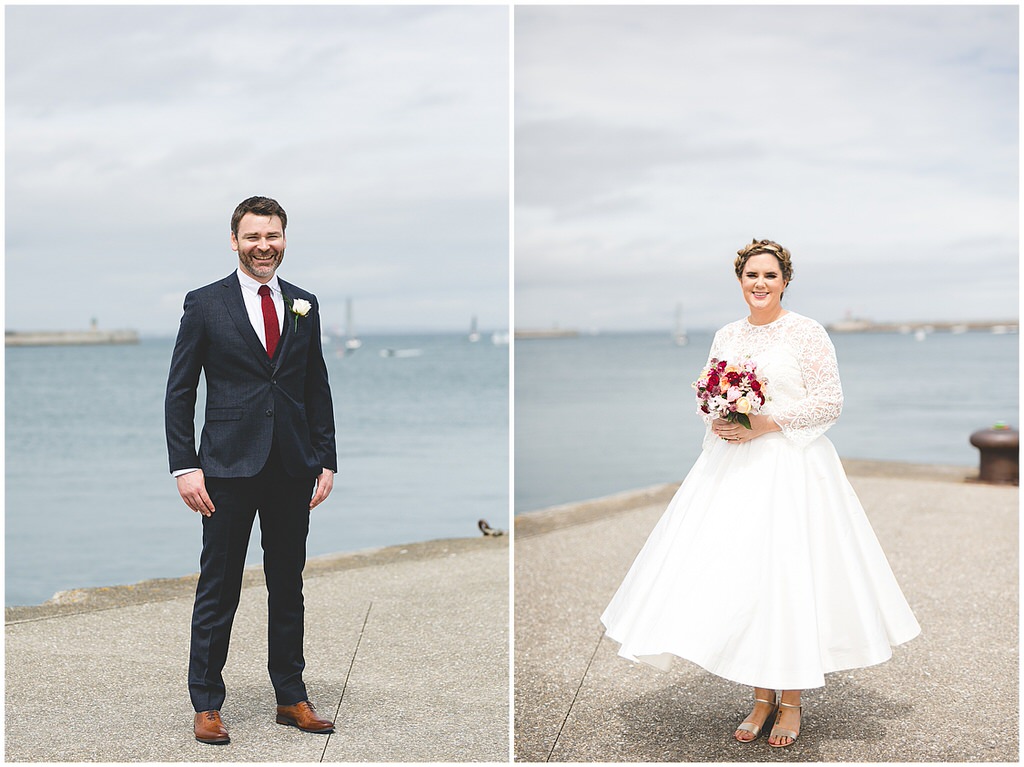 Full length portraits of the bride & groom by the seas