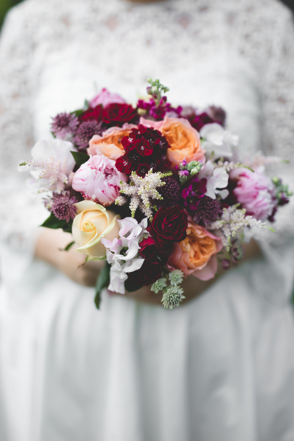 Orange, pink & burgundy, oxblood toned floral bouquet