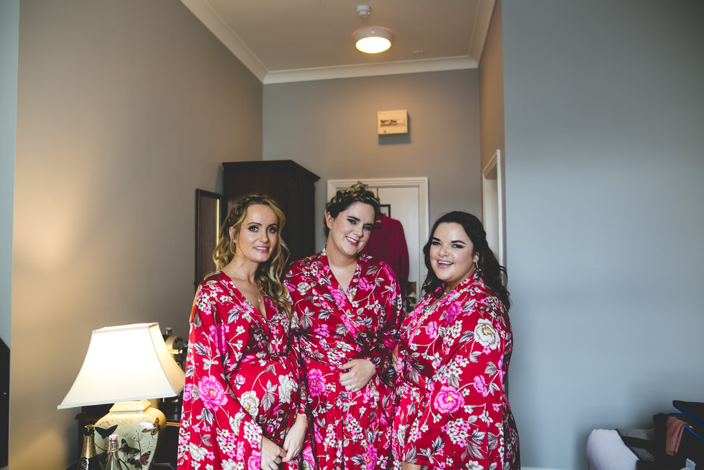 Bride squad in pink & red dressing gowns
